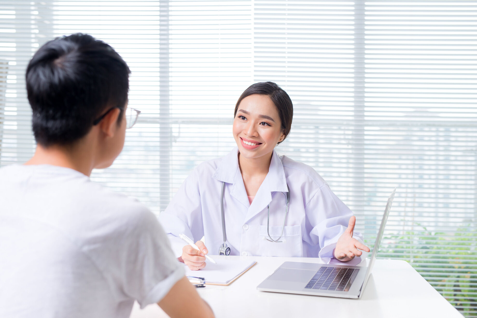 friendly-female-doctor-hands-hol